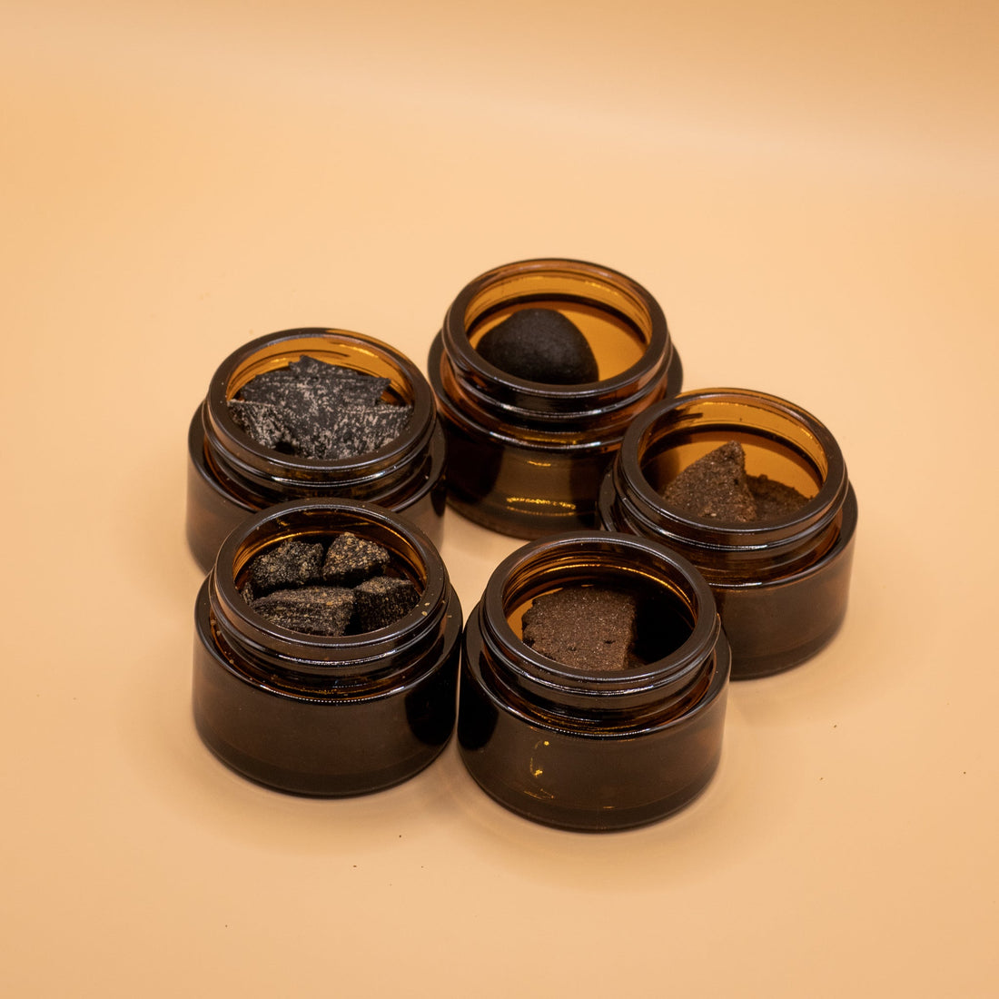 Five open amber jars showing different Misk bakhoor blends
