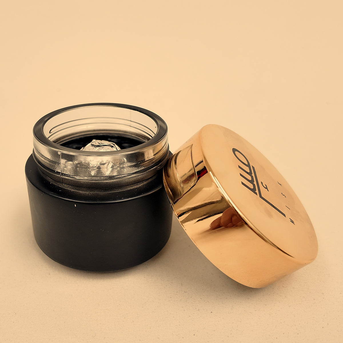 Mahaja handmade bakhoor — open jar showing the foil-wrapped pieces